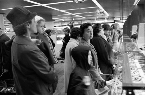 The work of a housewife and mother shopping for groceries at the supermarket and Aldi