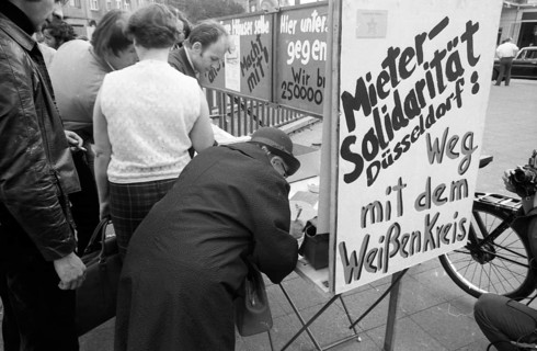 Tenants protest with a collection of signatures