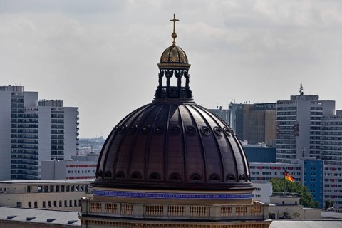 Dome of the Humboldt Forum and skyscrapers above the roofs of the city