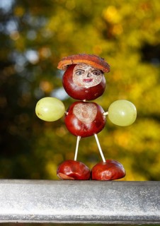 Chestnut figure with grapes in the evening light