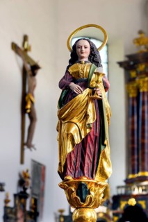 Female saint figure with host chalice