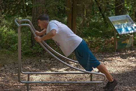 Young man on a fitness course