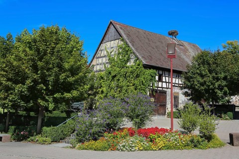 Square on the main road with flower bed