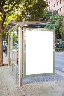 Billboard at bus stop with trees