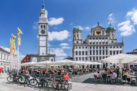 Restaurant terraces on the town hall square with Perlachturm and town hall