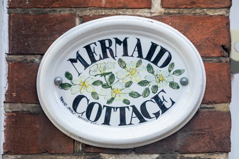 Sign with house name