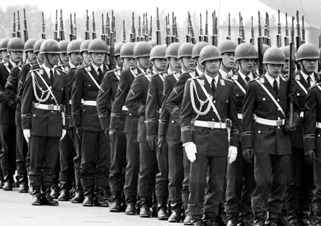 With full military honours