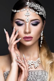 Beautiful girl in the image of the Arab bride with expensive jewelry
