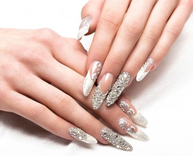 Beautifil wedding manicure for the bride in gentle tones with rhinestone. Nail Design. Close-up