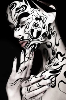 Beautiful girl with art black and white makeup and nails. Creative beauty face. Photo taken in the studio