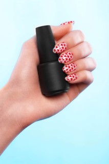 Black bottles of nail polish on a blue background. Manicure design