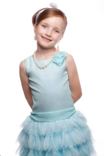 A little girl in a blue dress