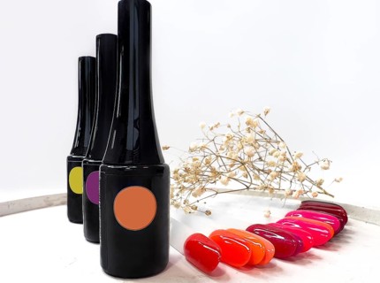 Black bottles of nail polish on a white background with flowers. Manicure design