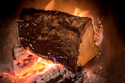Burning log in the fireplace