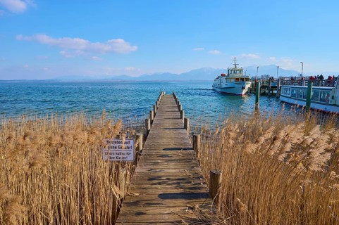 Lake Ciemsee wooden jetty and excursion boat