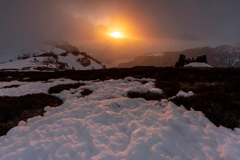 Sunset on the Niederhorn with cloudy sky
