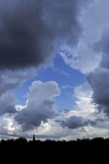Gap in white and grey clouds