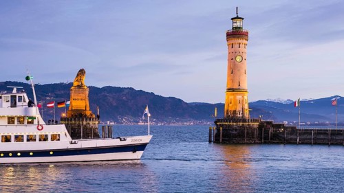Harbour with lighthouse and Bavarian Lion