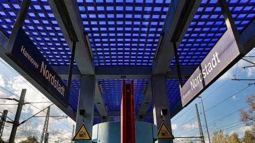 Platform with roof of blue glass blocks and fair-faced concrete