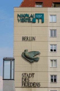 House facade with dove and lettering City of Peace