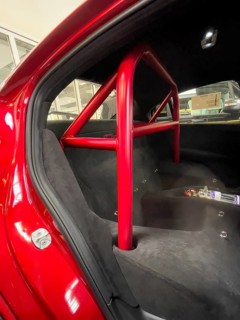 View into the rear of the car Interior of the car with removed rear seat Roll-over bar Trough for helmet storage of limited edition 500 Italian sports car Alfa Romeo Giulia GTAm