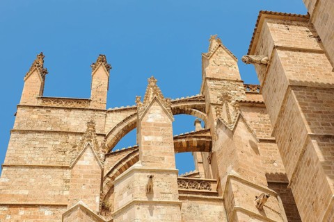 Architectural details turret cross braces for dissipation of weight pressure at gothic cathedral of St. Mary La Seu in gothic architectural style gothic architecture