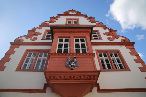 Renaissance town hall with oriel and coat of arms and tail gable