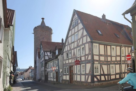 Historic Leonhard Tower built in 1386 and half-timbered house in Fuldauer Gasse