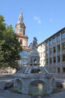 Siegfried Fountain on the Market Square and Tower of Holy Trinity Church