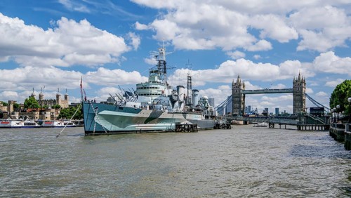 Museum Ship HMS Belfast on the Thames with Tower and Tower Bridge