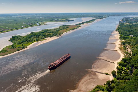 Aerial view of a cargo ship in the shipping channel of the Elbe near Blankenese in the direction of the North Sea. Right picture: Wedel power station