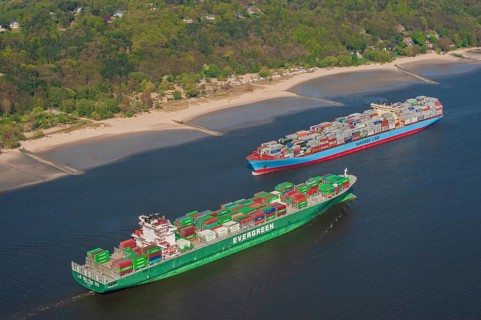 Aerial view of two container ships in the meeting box of the Elbe at the Falkenstein bank
