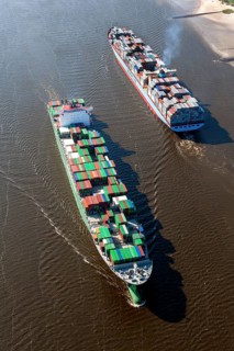 Aerial view of two container ships in the meeting box of the Elbe at the Falkenstein bank