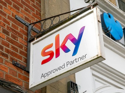 Sky Approved Partners wall hanging sign outside shop