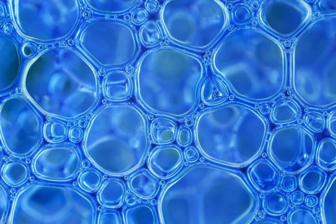 Blue foam bubbles in close-up