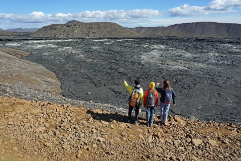 Hikers look down on solidified lava