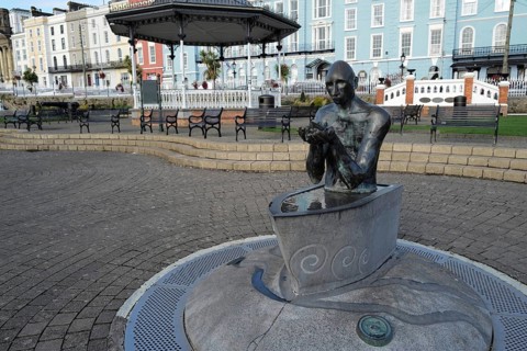 The Navigator statue showing a Christ-like figure in a boat by the sculptor Mary Gregoriy in Cobh