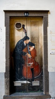 Colourful painted door with musician playing double bass