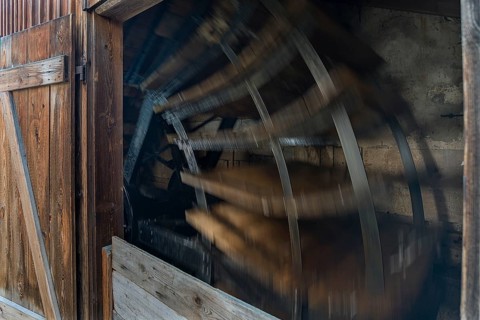 Water wheel in motion at a historic mill