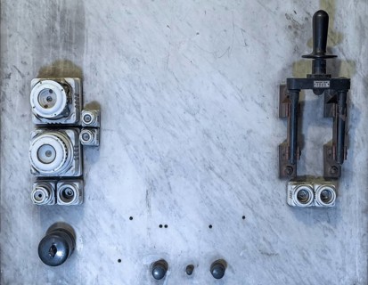 Panel with fuses and levers in the historic electric power plant factory