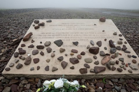 Memorial plaque for woman and girls in beech forest concentration camp