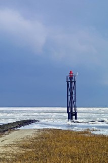 Lighthouse at the harbour entrance of Fedderwardersiel