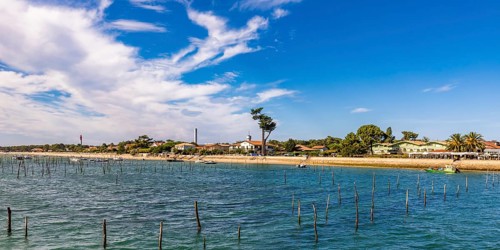 Village view with beach and lighthouse