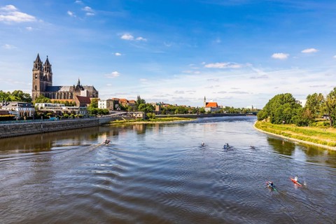 Magdeburg Cathedral and canoeists on the Elbe