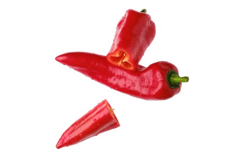 Top view of sweet capia pepper whole and cut on half isolated on white background