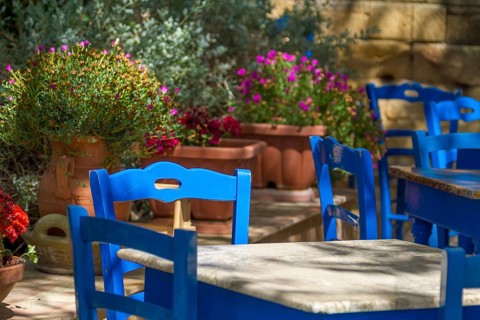 Blue tables and chairs in a cafe