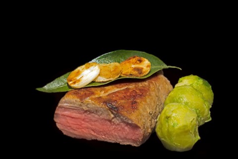 Roasted pork fillet with garlic and Brussels sprouts