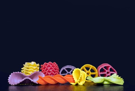 Colourful pasta in different shapes