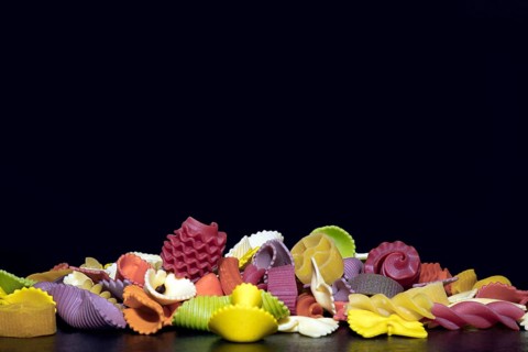 Colourful pasta in different shapes