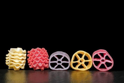 Colourful pasta in different shapes